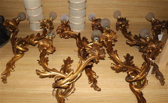 A set of five Louis XV design gilt metal two branch wall lights